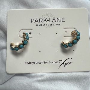 Blue half hoop earrings by Park Lane.